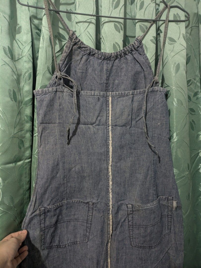 Baton Rouge Denim Dress Size 38 (Category: Dresses) located in Bocaue. Submitted by _agentorange (Listing ID 1469725056, Image 2). Description: - Brand: Baton Rouge - Size: 38 - Color: Blue - Material: Lightweight chambray - Style: Sleeveless with thin adjustable shoulder straps - Details: Gathered neckline and trendy exposed center seams (front and back) - Pockets: Two functional back pockets issue: needs wash and slight discoloration on the str