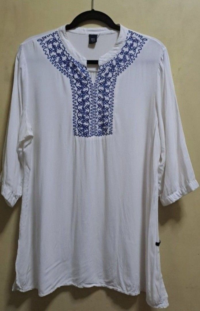 Bayo White Blouse (Category: Blouses) located in Manila. Submitted by thrifter_lifestyle (Listing ID 1469618953, Image 1). Description: Brand: Bayo 3/4 sleeves, can be folded Falls below waist Embroidery in front in royal blue, added photo for appreciation Bust: 46" Shoulder to Hem: 31" Material: Cotton No issues 🙂 RFS: closet spring cleaning.