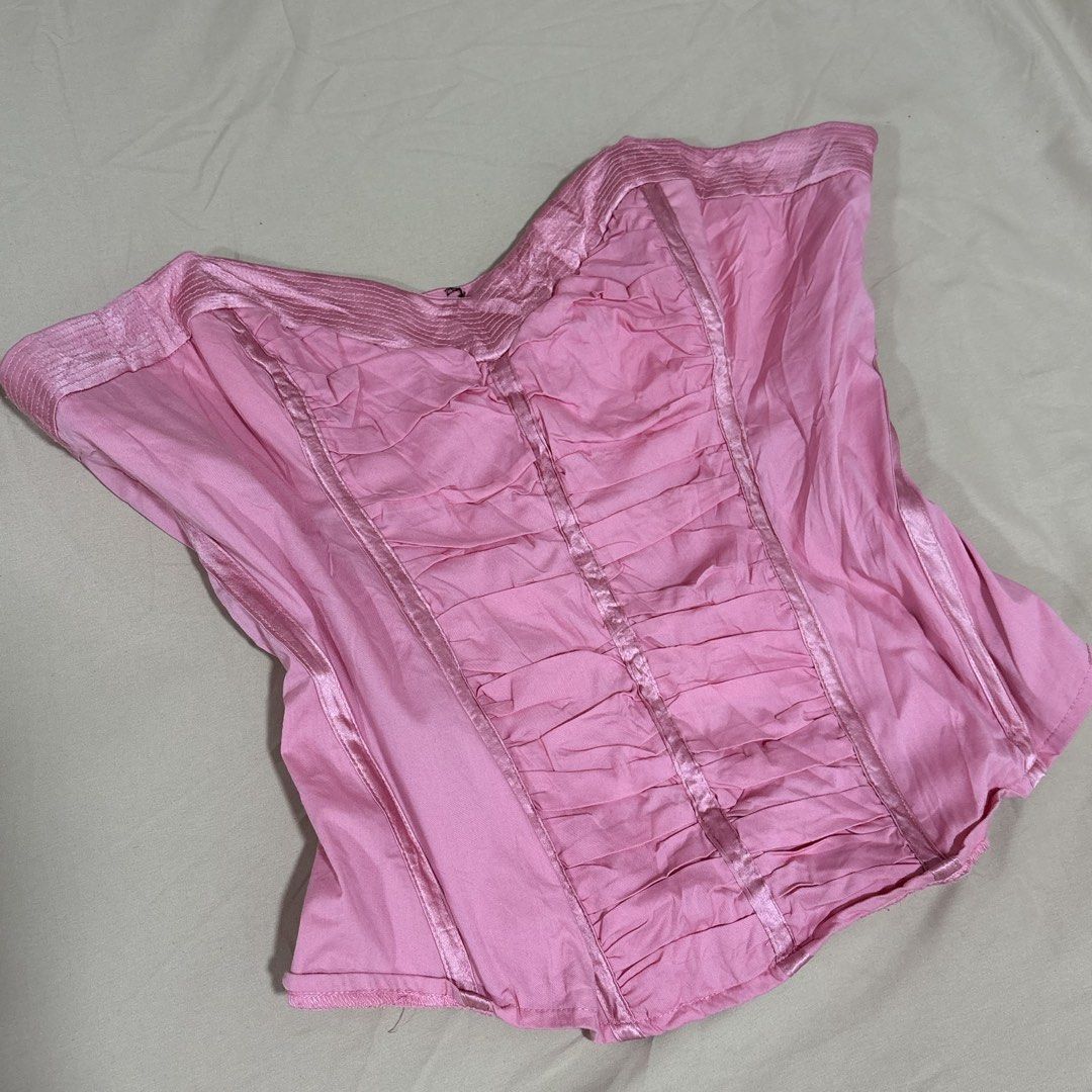 BEBE Peony Pink Ruched Corset Top Size L (Category: Sleeveless) located in Tuguegarao City. Submitted by shopaholiccccs (Listing ID 1469624802, Image 2). Description: - Brand: Bebe - Style: Corset top - Color: Peony Pink - Size: L - Material: Shell 1 (Cotton, Nylon, Spandex) & Shell 2 (Silk, Spandex) - Design: Sweetheart neckline with gathered ruching down the front - Details: Interior branded ribbon hanger straps - Origin: Made in China.