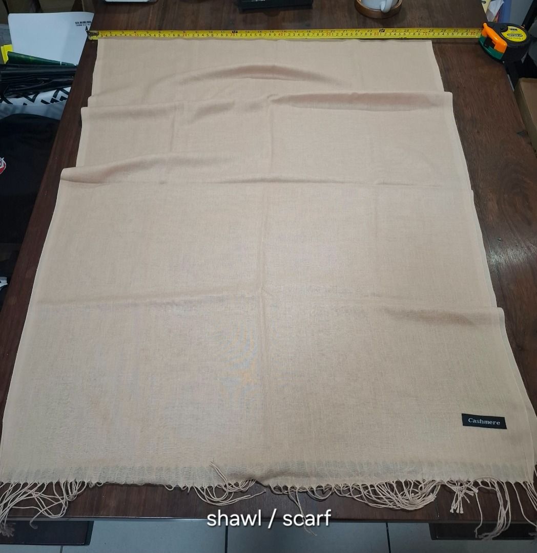 Beige Fringed Shawl (Category: Scarves) located in Pasig City. Submitted by dripcounty (Listing ID 1469686331, Image 1). Description: Beige Fringed Shawl ₱150 Bought in the Philippines Size: Free size Condition: Good / preloved Beige shawl with fringed ends. Fiber composition unconfirmed. Actual item shown in photos. Delivery fee shouldered by buyer (Lalamove / other courier). Item price excludes delivery. Payment via cash / GCash / bank transfer