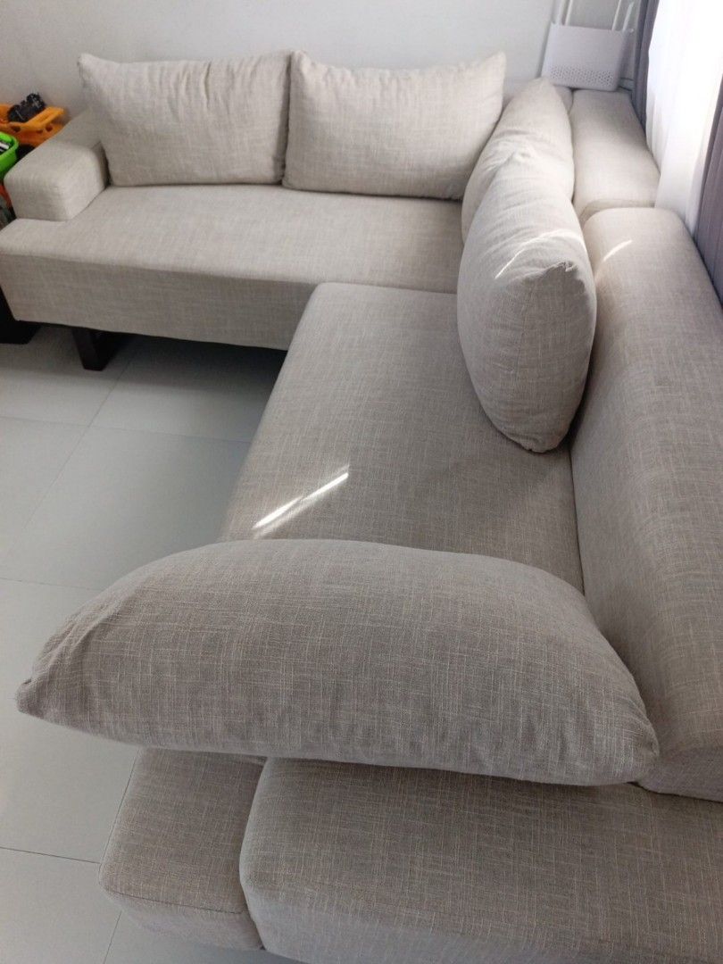 Beige L-shaped Fabric Sofa with Pillows (Category: Sofas) located in Santa Rosa. Submitted by iespanol0530573 (Listing ID 1469617797, Image 1). Description: 💰 Original price: ₱25,000 💵 Selling price: ₱18,000 negotiable 📍 Location: Santa Rosa, Laguna 📅 1 year old ✨ Condition: Good / well-maintained Still very sturdy and comfortable Foam is still firm — no sinking or sagging No tears or major damage Clean overall and perfect for a family home N