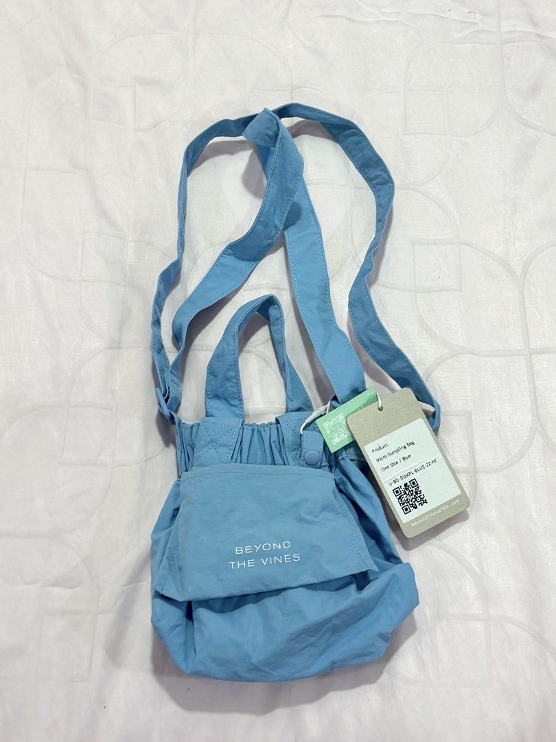 Beyond The Vines Micro Dumpling Bag in Blue (Category: Cross-body Bags) located in Manila. Submitted by morningkofi (Listing ID 1469704387, Image 2). Description: - brand new never used with tag - rfs: want a bigger one - water-resistant nylon - measurements are on the listing .