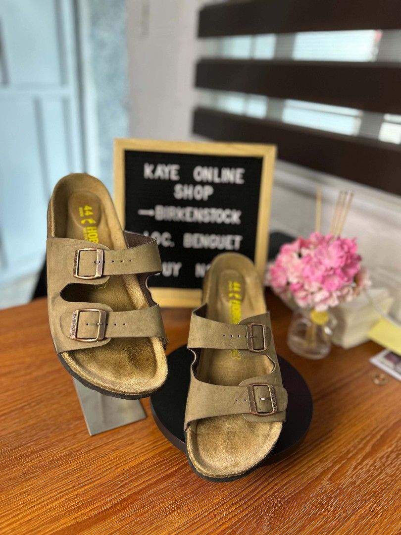 Hoboken two-strap slip-on sandals (Category: Slippers & Slides) located in Baguio. Submitted by kayeonlineshop (Listing ID 1469615940, Image 3). Description: Birkenstock Arizona sandals in a brown or taupe shade with a two-strap buckle design. color:brown size:44/240.