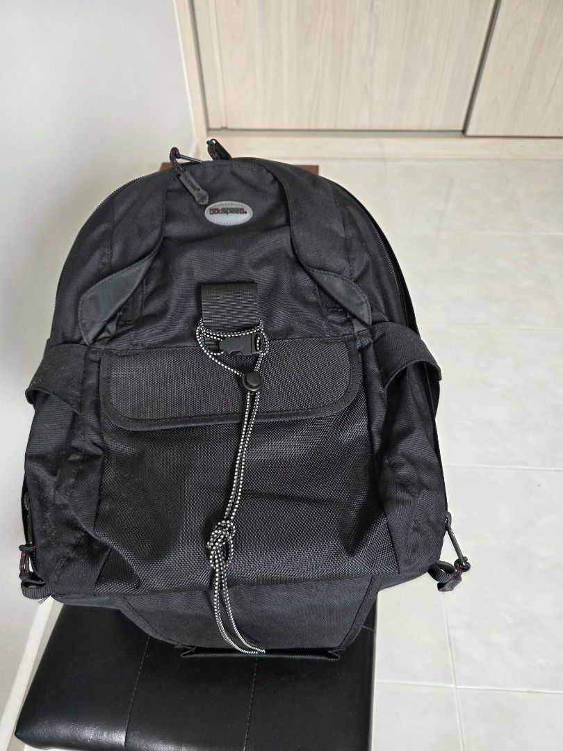 Black Camera Backpack (Category: Camera Bags & Carriers) located in Singapore. Submitted by andlpc2012 (Listing ID 1469701949, Image 4). Description: - Color: Black - Fully adjustable interior padded dividers for bodies and lenses - Multiple exterior pockets and secure bungee strap system - Sturdy top handle and side straps - Clean interior lining with mesh zippered pockets on the flap - Ideal practical gear bag for photographers can hold tripod,