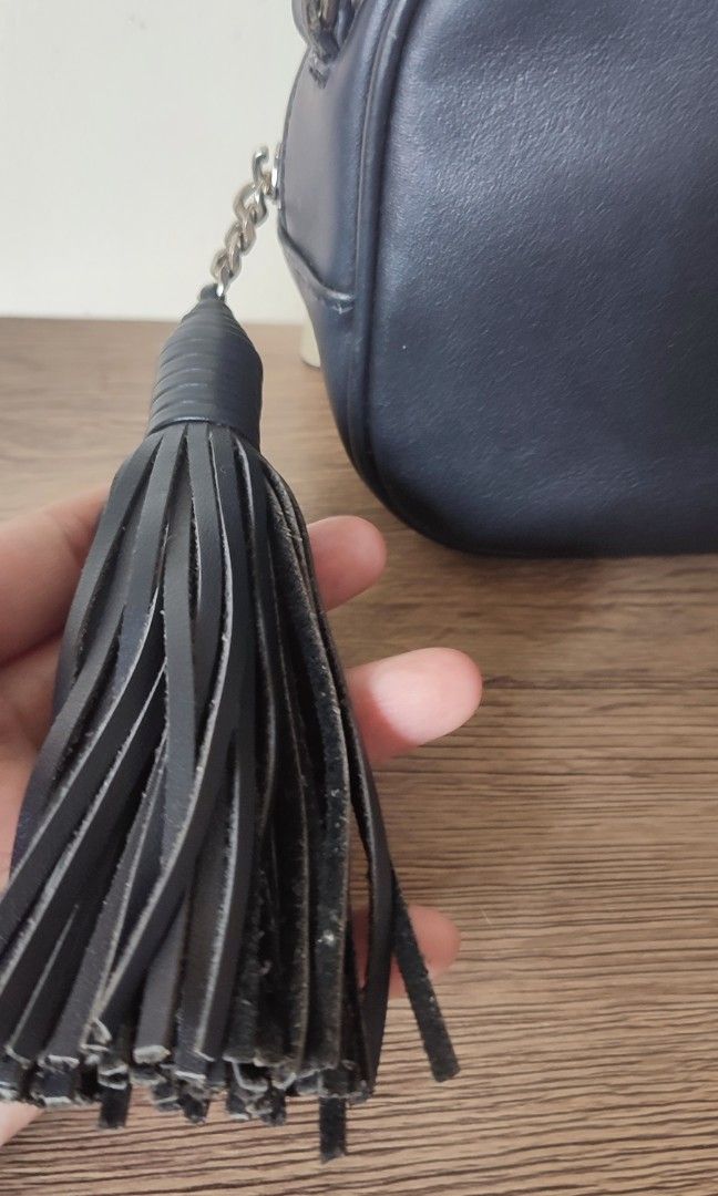 Black crossbody handbag strap (Category: Cross-body Bags) located in Caloocan City. Submitted by guiltypleasures75 (Listing ID 1469606494, Image 2). Description: YSl Mini Camera bag , with sign of usage issue - very small part of rubber lining issue , scratch on metal part as common sign of usage . .