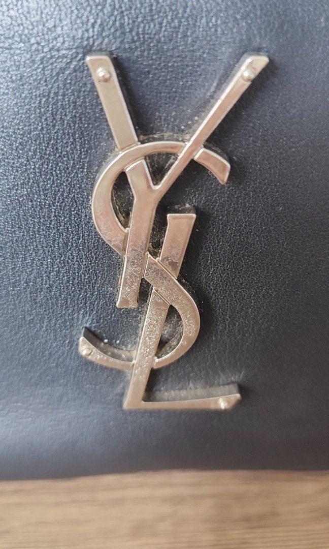 Black crossbody handbag strap (Category: Cross-body Bags) located in Caloocan City. Submitted by guiltypleasures75 (Listing ID 1469606494, Image 3). Description: YSl Mini Camera bag , with sign of usage issue - very small part of rubber lining issue , scratch on metal part as common sign of usage . .