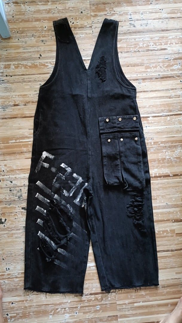 Black Distressed Denim Overalls With Painted Graphics (Category: Jumpsuits) located in Dasmarinas. Submitted by kheiko086 (Listing ID 1469617589, Image 1). Description: size W:36" L:36 from waist adj strap non stretch hard denim EUC LH:10 JNT Delivery Style: Edgy streetwear black denim overalls - Details: Heavy distressing, raw hems, and a sleeveless deep V-neck tank top with distressed straps.