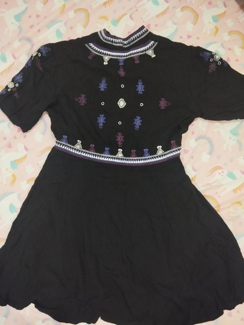 Black embroidered dress with drawstring and hooks (Category: Dresses) located in Dagupan City. Submitted by nahamul_1508 (Listing ID 1469736024, Image 2). Description: - Color: Black with blue, purple, and white embroidery - Design: Colorful embroidery across front and back - Fit: Adjustable drawstring waist and short sleeves - Closure: Hook-and-eye placket down the front - Fabric: Lightweight and comfortable.