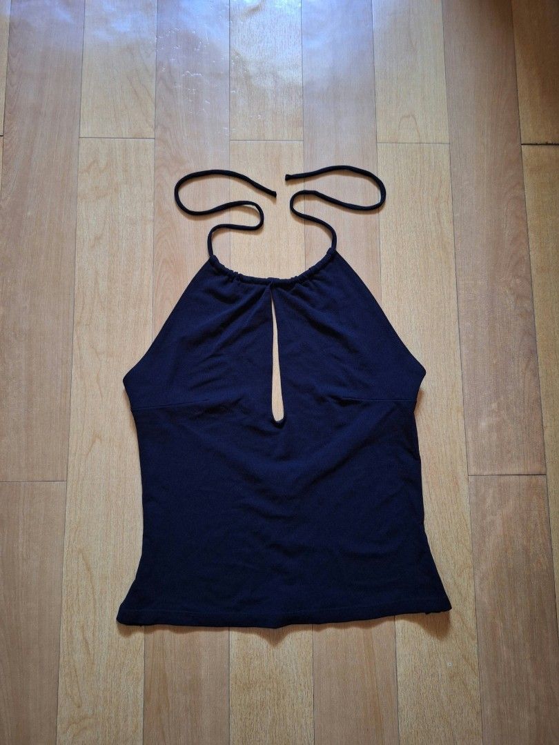 Black Halter Top Keyhole Cutout (Category: Sleeveless) located in Cabuyao City. Submitted by love.gie (Listing ID 1469446008, Image 1). Description: Solid black halter top featuring a front keyhole cutout, thin tie-neck straps, and smooth, stretchy fabric. Perfect for warm weather or going out. Clean and ready to wear. -no flaw -can fit to semi Large Price: 180 + sf.