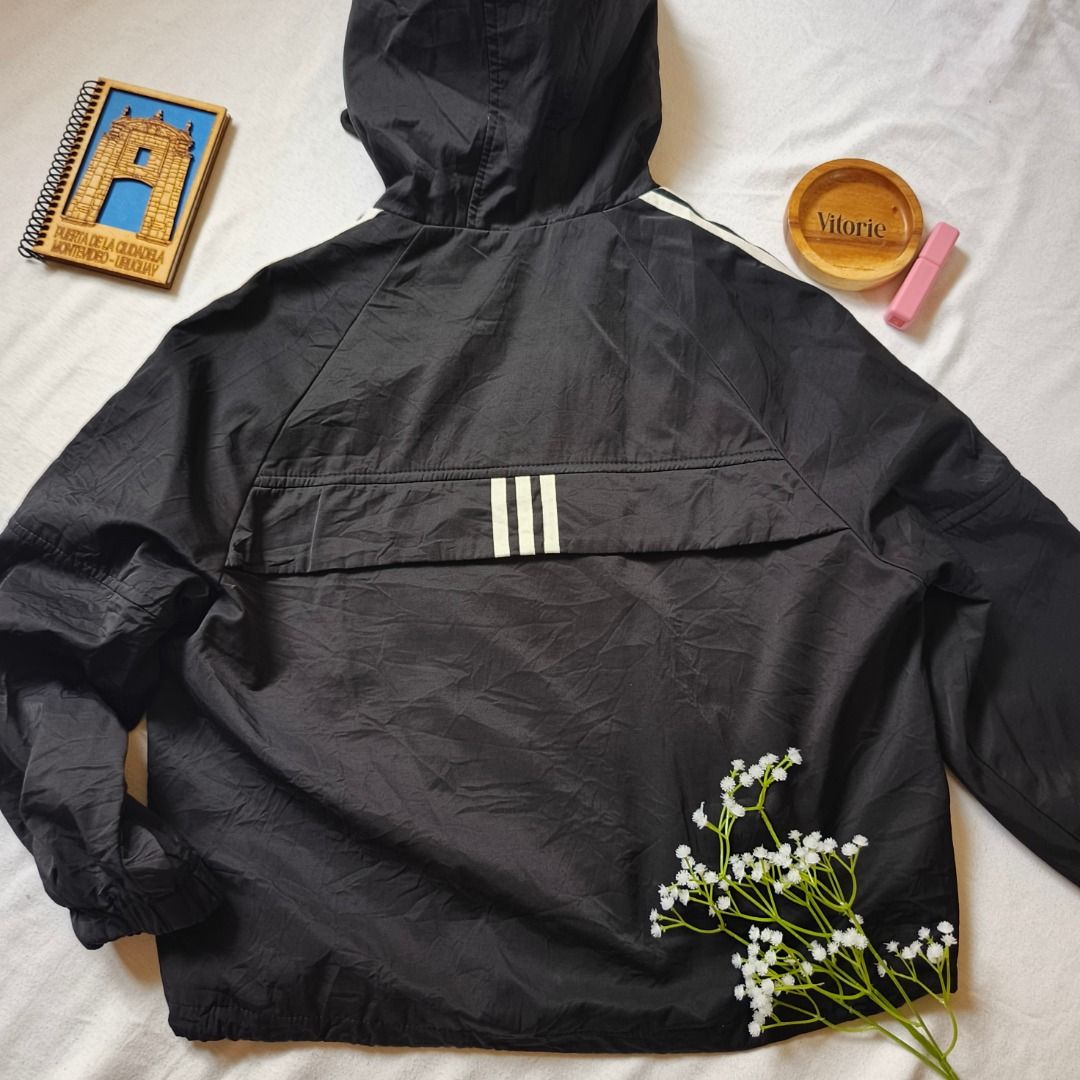 Black Hooded Jacket With White Stripes Size Large (Category: Coats, Jackets and Outerwear) located in Cabuyao City. Submitted by vitorieclothing_lifestyle (Listing ID 1469674989, Image 2). Description: - Color: Black with iconic white stripes down both sleeves - Closure: Full zipper plus snap buttons down the front - Features: Adjustable drawstrings on the hood - Measurements: Shoulder 17", Bust 44", Length 23", Sleeves 25", Arm circumference 16"