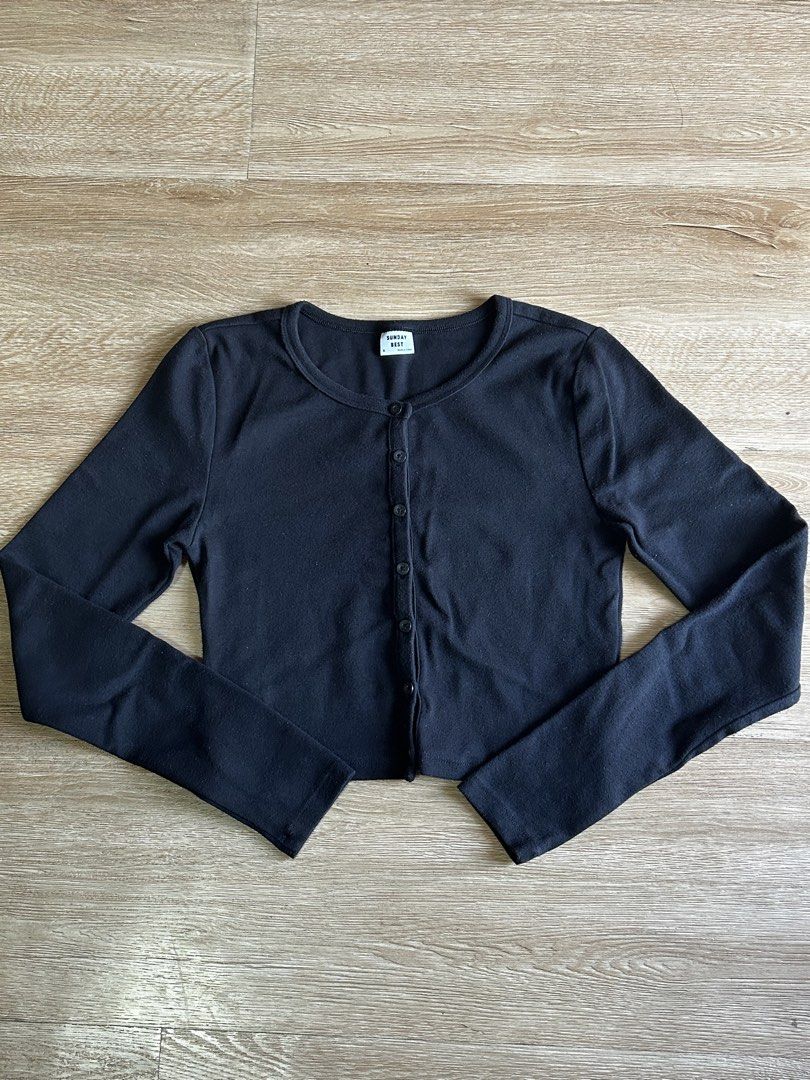 Black Knitted Crop Cardigan (Category: Longsleeves) located in Taguig. Submitted by my.serendipithrift (Listing ID 1469639472, Image 1). Description: Size: XS-S Knitted fabric Malambot sa balat tela Semi cropped Black in person Washed and ready to wear.