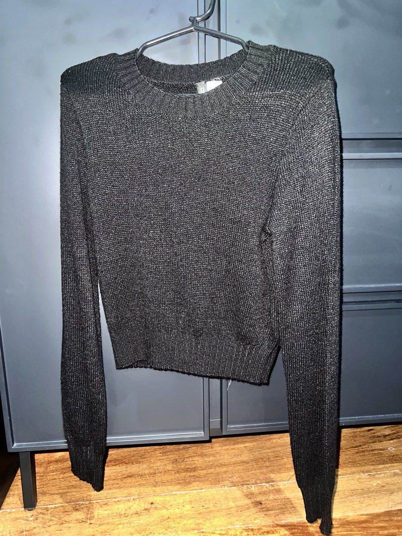 Black Long-Sleeve Ribbed Knit Sweater (Category: Longsleeves) located in Manila. Submitted by charmssin75605 (Listing ID 1469678596, Image 1). Description: - Color: Black with subtle metallic thread - Design: Long-sleeve knit sweater with crew neckline - Details: Ribbed cuffs, hem, and collar for a snug fit - Fit: Slim silhouette that flatters the body - Perfect for: Cool weather layering and everyday style.