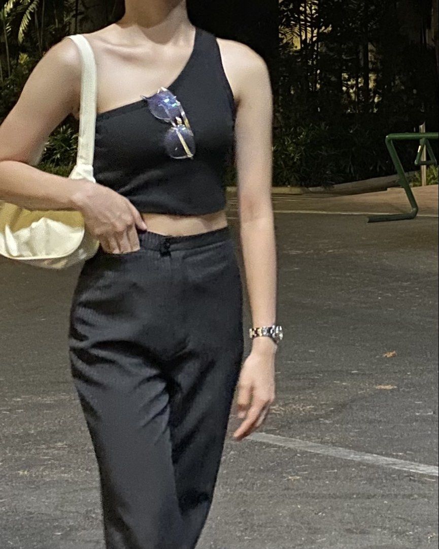 Black One-Shoulder Crop Top (Category: Sleeveless) located in Manila. Submitted by plsbuymyclotheshehe (Listing ID 1469629505, Image 2). Description: - Color: Black - Style: One-shoulder, fitted crop top - Material: Super comfortable and stretchy fabric - Condition: Great (worn only once) - Versatility: Easy to dress up or down; pairs perfectly with high-waisted pants or jeans - Perfect for: Night outs or casual days.