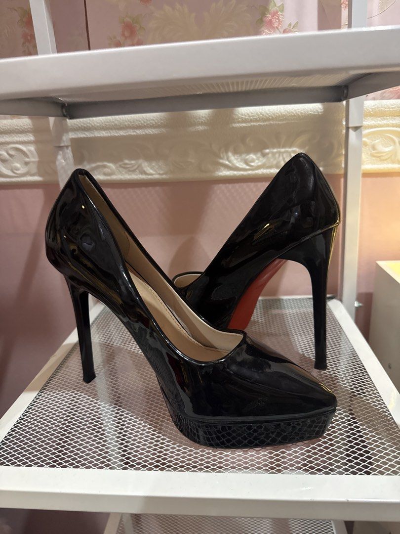 Black Patent Platform Stilettos with Red Soles (Category: Heels) located in Bacoor. Submitted by micsr (Listing ID 1469639526, Image 3). Description: Size 36 - Style: Black patent leather pumps with high stiletto heels - Design: Classic pointed toe with striking red outsoles - Comfort & Detail: Textured platform sole and neutral beige inner lining - Fit: High-rise heel silhouette for a stunning look.