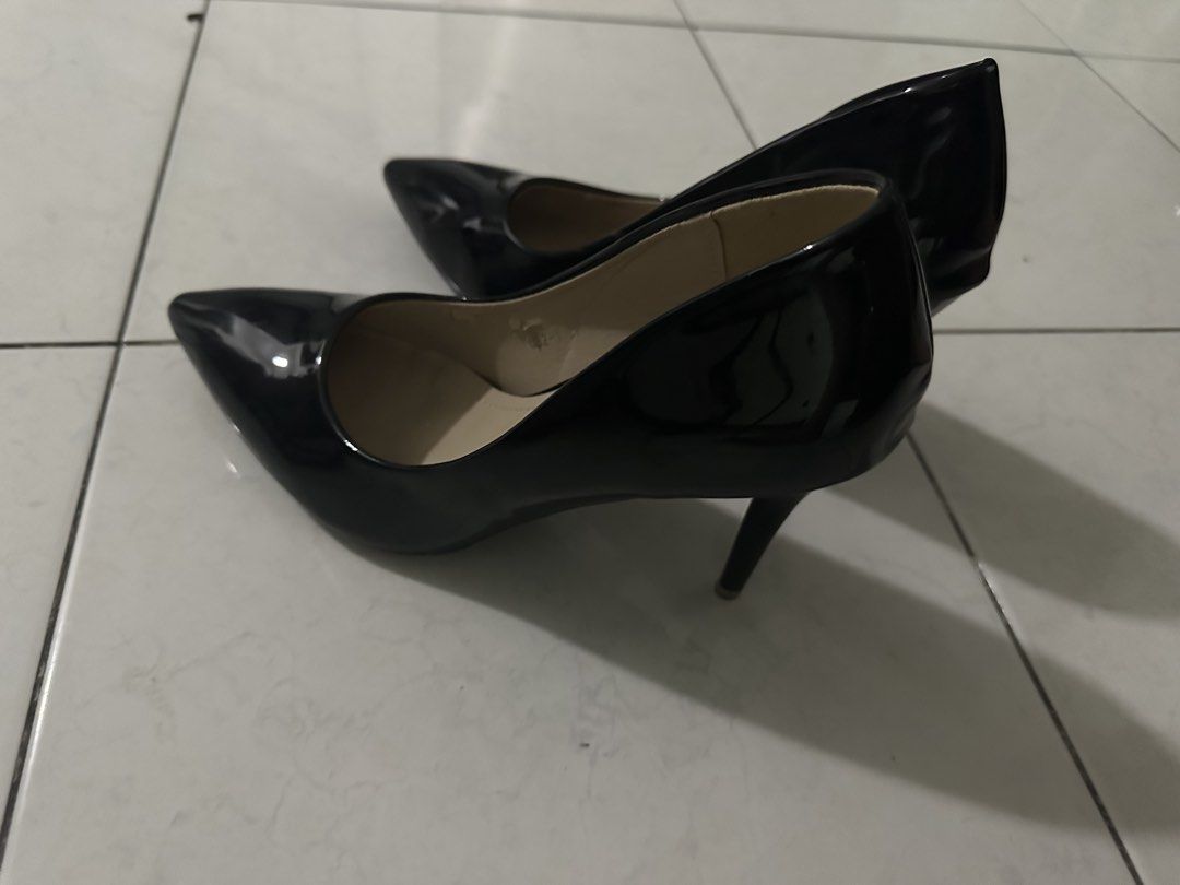 Black Patent Pointed Toe Heels (Category: Heels) located in Manila. Submitted by isabella_201013 (Listing ID 1469741017, Image 2). Description: - Brand/Model: Black patent leather pointed toe heels - Style: Classic court shoe, slip-on design with a glossy finish and beige insoles - Condition: Clean inside and out, flaking of the skin on the inside of the shoe, minimal signs of wear on the soles, and scratches - Versatility: Ideal for office wear,