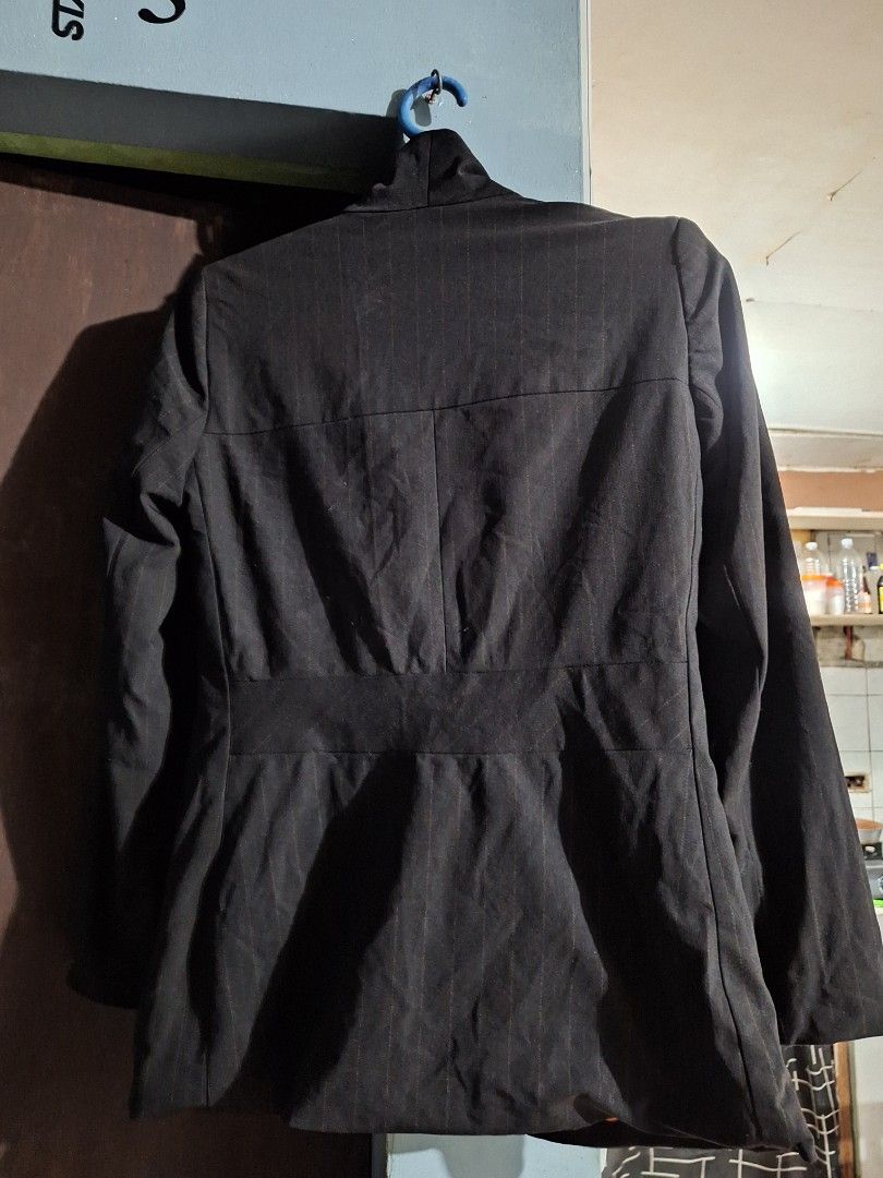 Black pinstripe blazer with orange lining (Category: Coats, Jackets and Outerwear) located in Manila. Submitted by bitna44 (Listing ID 1469670380, Image 2). Description: - Color: Classic black with subtle pinstripes - Lining: Vibrant bright orange inner lining for a stylish contrast - Closure: Three-button front - Details: Standard lapels and structured shoulders for a sharp fit - Versatility: Perfect for office wear, formal occasions, or smart c