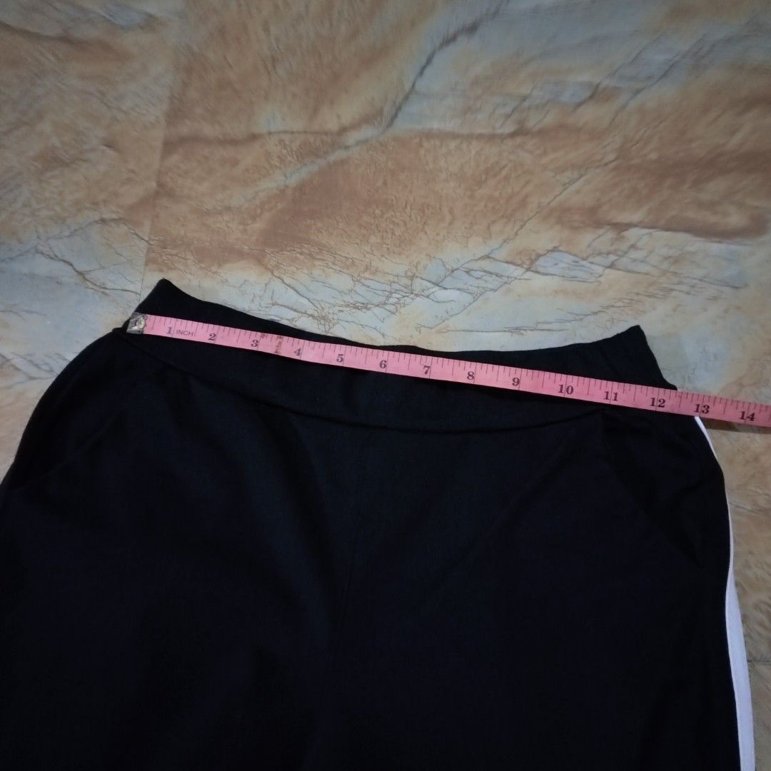 Black Side-Stripe Flare Yoga Pilates Pants (Category: Other Bottoms) located in Valenzuela. Submitted by 0003c4 (Listing ID 1469711747, Image 3). Description: fitted silhouette through the hips and thighs, slightly stretchy-looking fabric with flared hems fits 24-45 waist please note: slight stitching/fabric imperfection along the white side stripe. See photo for reference. ww and condition pics r provided but feel free to message me! location: V