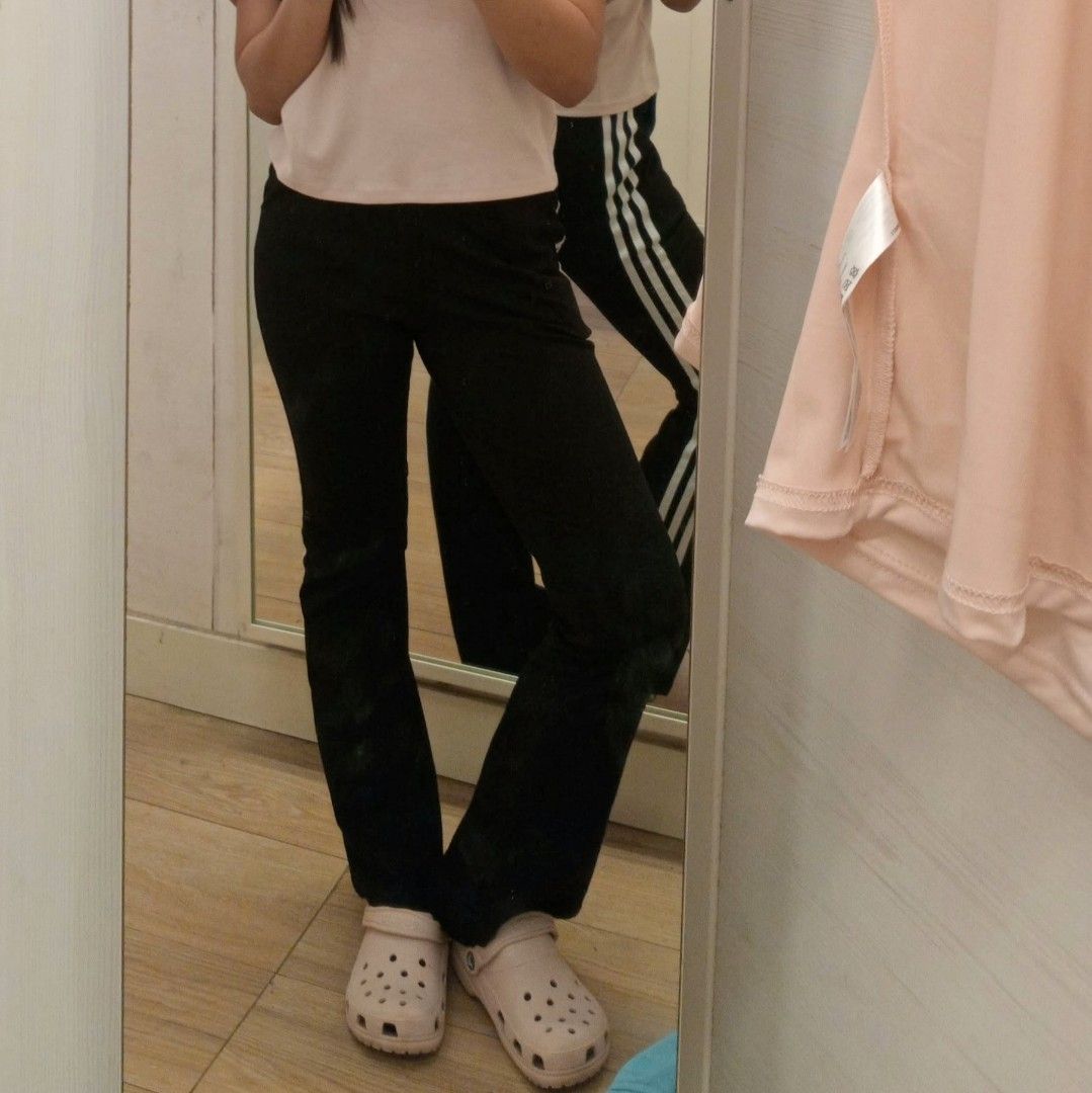 Black Side-Stripe Flare Yoga Pilates Pants (Category: Other Bottoms) located in Valenzuela. Submitted by 0003c4 (Listing ID 1469711747, Image 2). Description: fitted silhouette through the hips and thighs, slightly stretchy-looking fabric with flared hems fits 24-45 waist please note: slight stitching/fabric imperfection along the white side stripe. See photo for reference. ww and condition pics r provided but feel free to message me! location: V