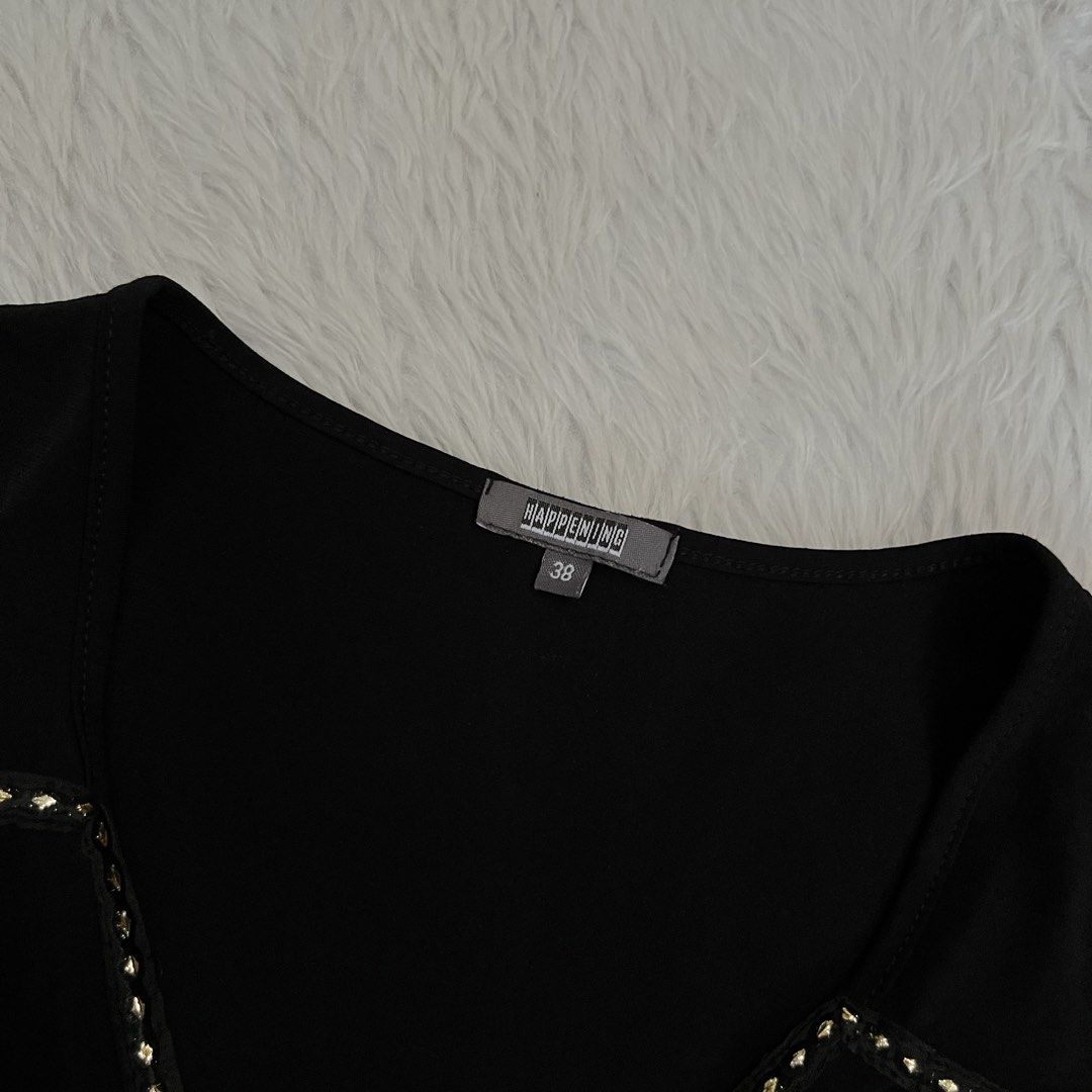 Black Sleeveless V-Neck Blouse Size 38 (Category: Sleeveless) located in Maasin. Submitted by taraa18 (Listing ID 1469584800, Image 3). Description: - Brand/Size: Harkening, Size 38 - Style: Sleeveless top with deep V-neckline and cinched flared hem - Details: Chic small gold studs along the collar edge and waistline - Fabric: Lightweight and comfortable - Versatility: Perfect for a night out; easily pairs with jeans or trousers.
