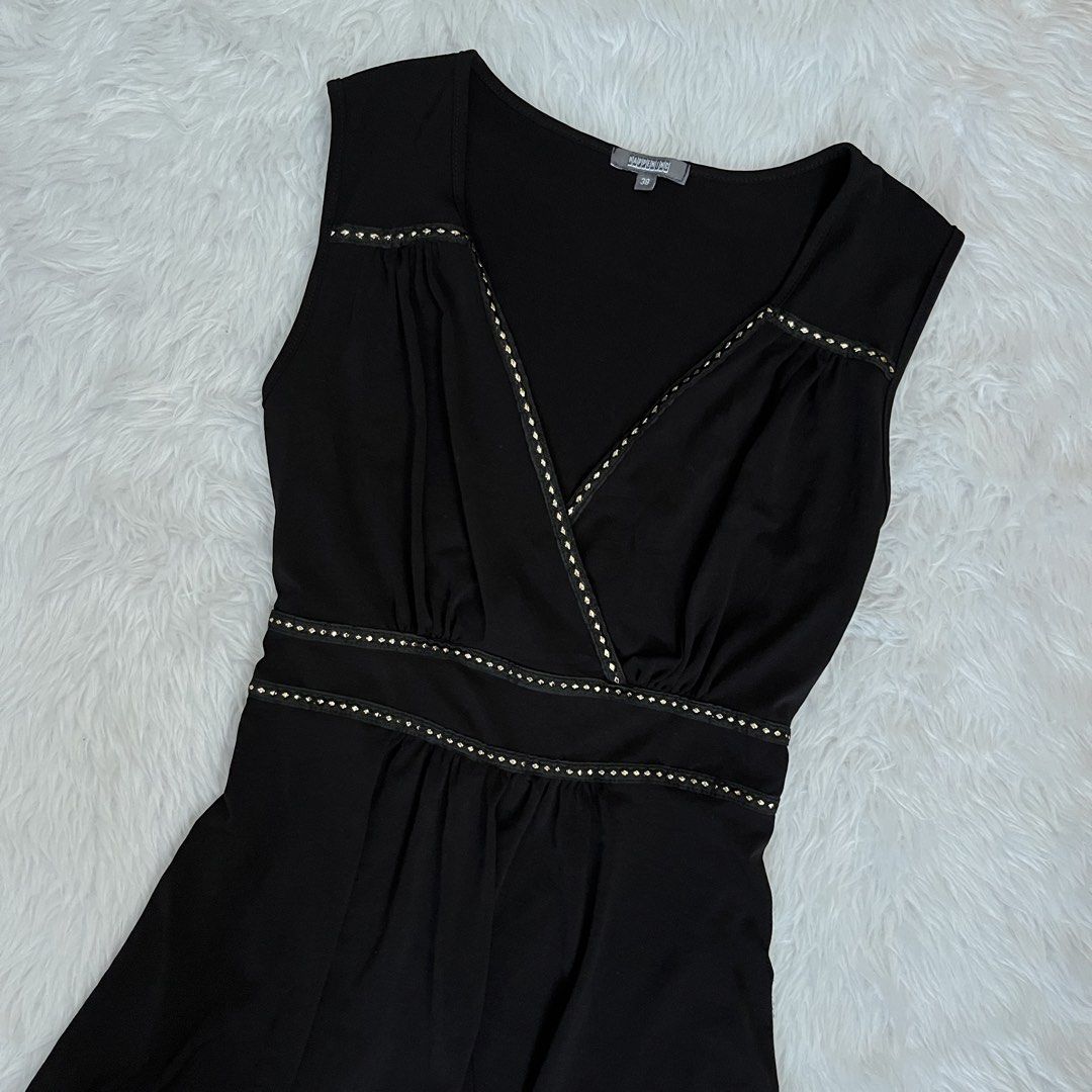 Black Sleeveless V-Neck Blouse Size 38 (Category: Sleeveless) located in Maasin. Submitted by taraa18 (Listing ID 1469584800, Image 2). Description: - Brand/Size: Harkening, Size 38 - Style: Sleeveless top with deep V-neckline and cinched flared hem - Details: Chic small gold studs along the collar edge and waistline - Fabric: Lightweight and comfortable - Versatility: Perfect for a night out; easily pairs with jeans or trousers.