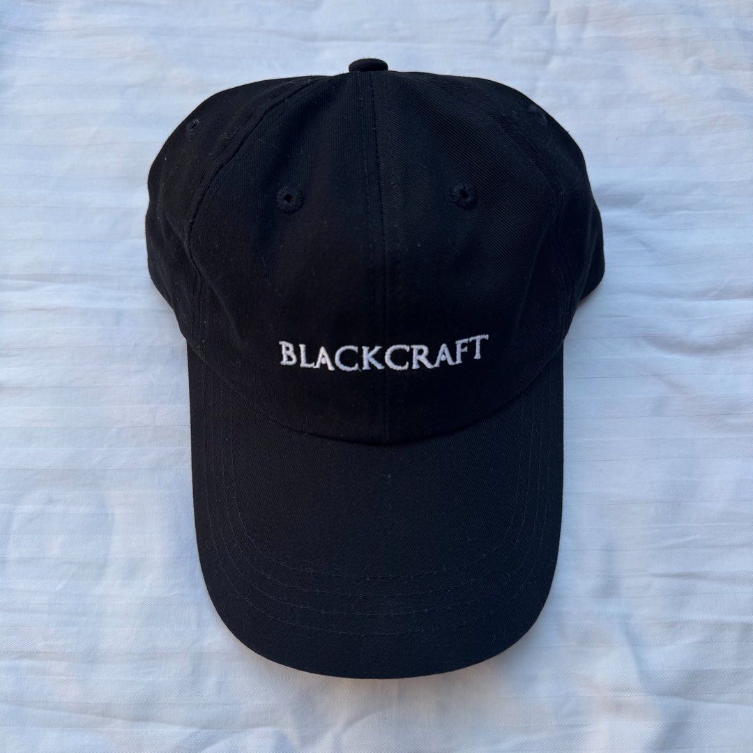 Blackcraft Cult Embroidered Black Dad Cap (Category: Caps & Hats) located in Manila. Submitted by safeowl.b6dbb0 (Listing ID 1469605836, Image 1). Description: - Brand: Blackcraft Cult - Color: Black with white embroidery - Front Design: 'BLACKCRAFT' embroidered lettering - Back Design: 'CREATE YOUR OWN FUTURI' embroidered above the strap - Fit: Classic dad hat style with a curved brim - Closure: Adjustable metal slider for a custom fit - Conditi