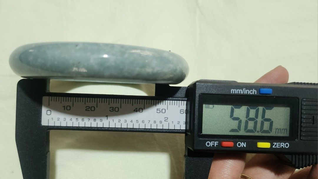 Blue Burmese Jadeite Bangle 58.6mm (Category: Bracelets) located in Baguio. Submitted by lausgem2026 (Listing ID 1469637817, Image 2). Description: -Blue Burmese Jadeite Bangle -Grade A (natural and untreated). -58.6mm diameter size. 12.4mm thickness. -Note: Is opaque (very little to no light passing through). -Comes with free box but no certificate. -Location: Baguio City.