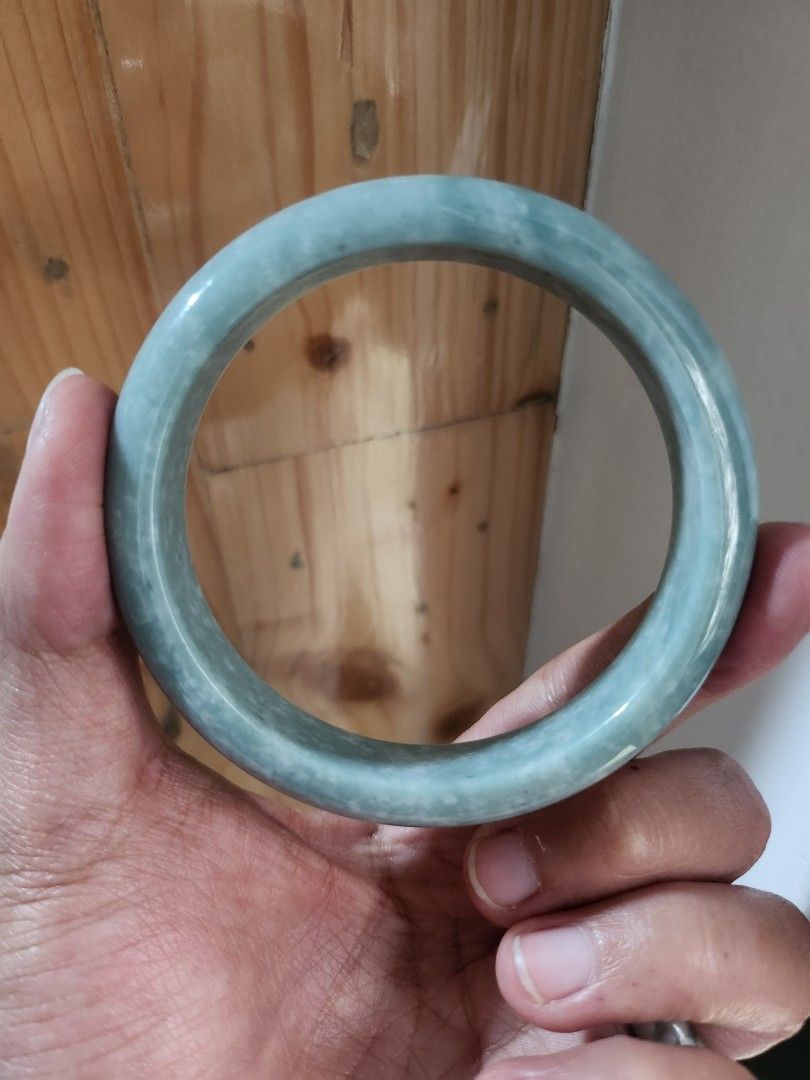 Blue Burmese Jadeite Bangle 58.6mm (Category: Bracelets) located in Baguio. Submitted by lausgem2026 (Listing ID 1469637817, Image 1). Description: -Blue Burmese Jadeite Bangle -Grade A (natural and untreated). -58.6mm diameter size. 12.4mm thickness. -Note: Is opaque (very little to no light passing through). -Comes with free box but no certificate. -Location: Baguio City.