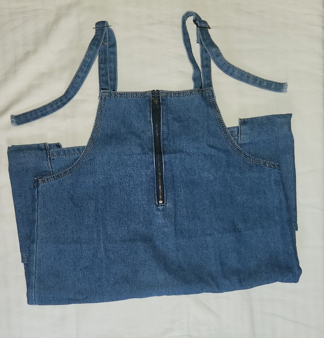 Blue Denim Overall Dress with Adjustable Straps (Category: Dresses) located in Caloocan City. Submitted by lexymochi (Listing ID 1469626278, Image 1). Description: - Color/Wash: Medium wash blue denim - Straps: Adjustable for a custom fit - Pockets: Two handy side pockets - Size: can fit S to M.