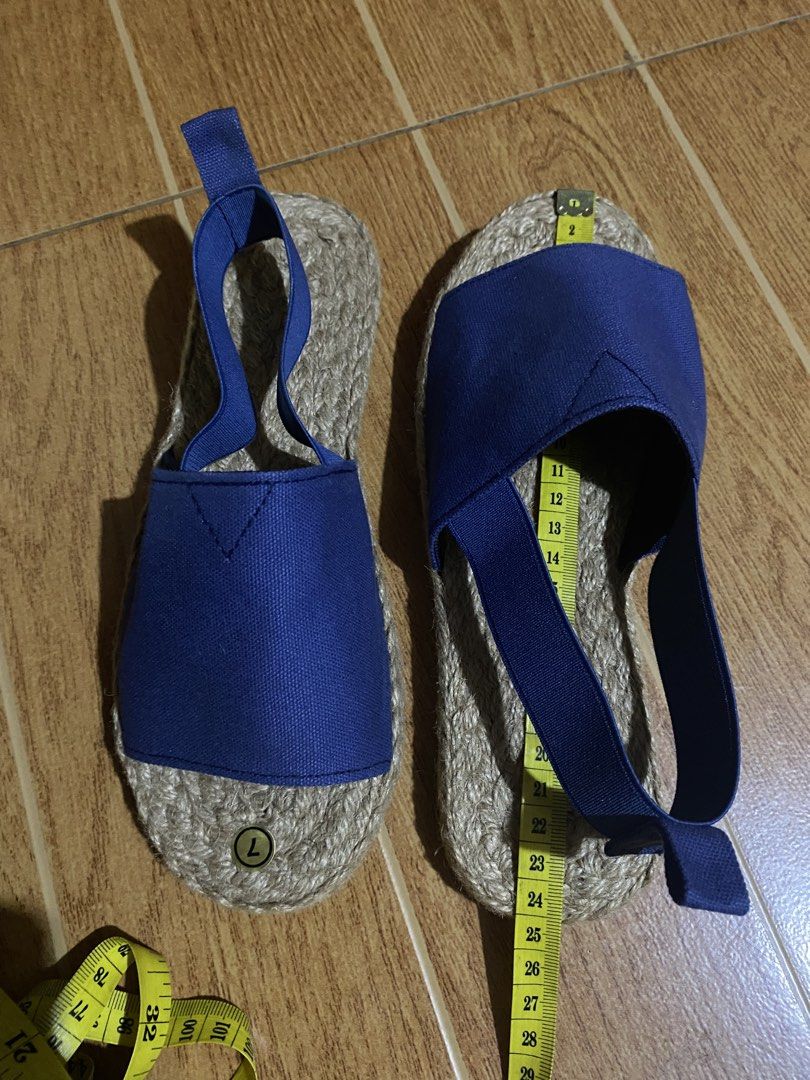 Blue Espadrille Sandals Size 7 Jute Sole (Category: Flats & Sandals) located in Paranaque City. Submitted by ilove.preloved (Listing ID 1469604553, Image 2). Description: - Style: Blue canvas espadrille sandals with slip-on design - Size: Tagged size 7 (measures approx. 24 cm in total length) - Comfort & Fit: Features a convenient back pull tab and elastic strap slingback - Material: Classic woven jute soles and durable canvas upper.