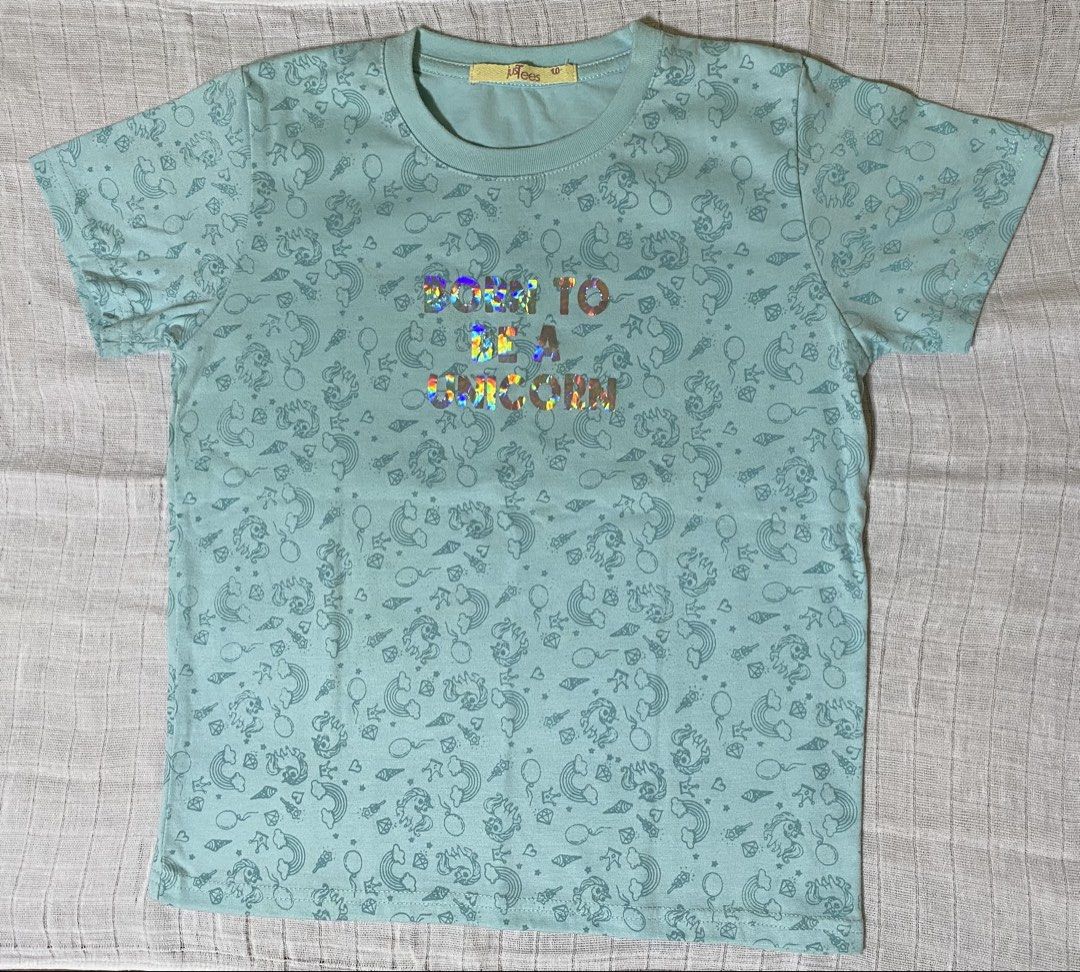 Blue green shirt (Category: Babies & Kids Fashion) located in Morong. Submitted by fcjonline528 (Listing ID 1469668111, Image 1). Description: This is preloved. Rarely used po ito kasi ang ganda nya tlga. No issue at all po ito. JusTees ang brand.