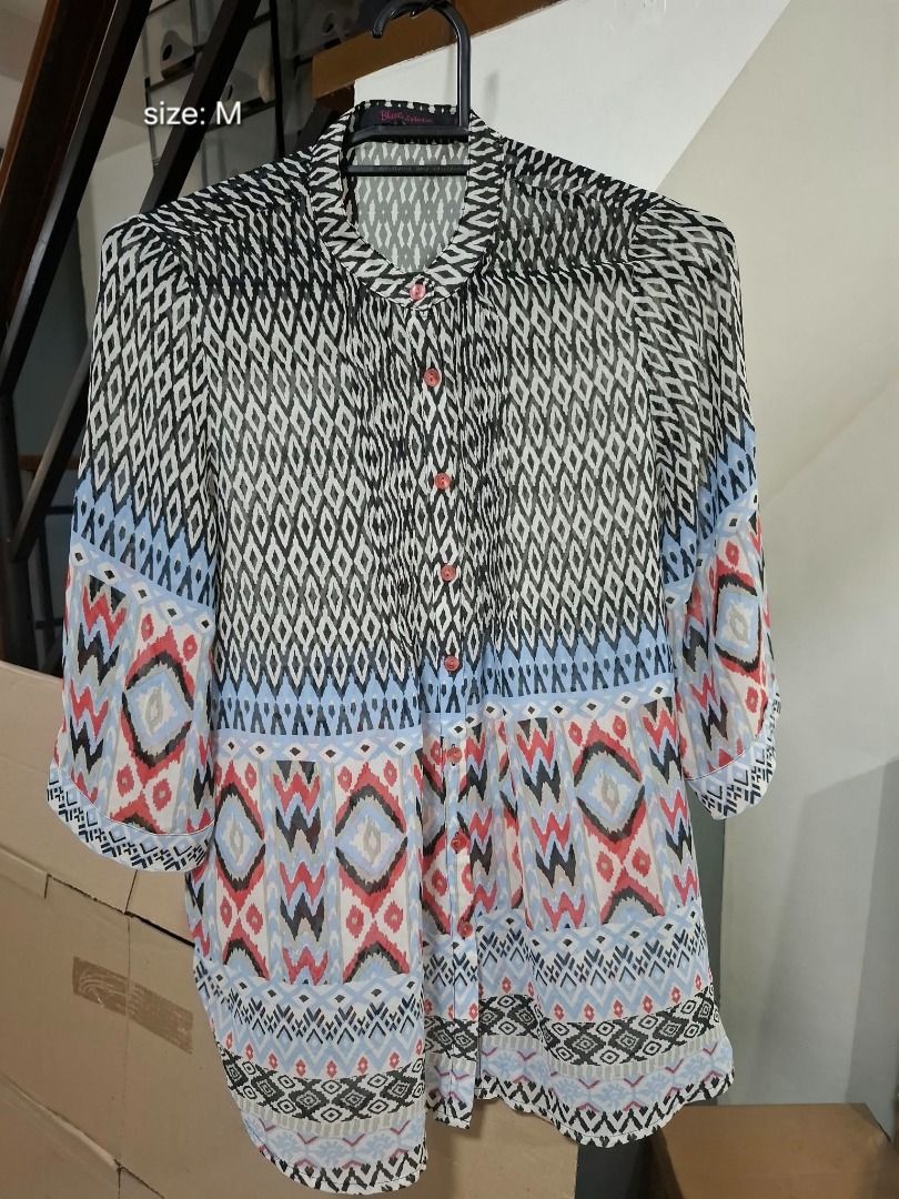 BLUSA COLLECTION Geometric Tunic Blouse (Category: Blouses) located in Pasig City. Submitted by dripcounty (Listing ID 1469688532, Image 1). Description: BLUSA COLLECTION Geometric Tunic Blouse ₱180 Bought in the Philippines Size: Medium Condition: Good / preloved Multicolor geometric button-front tunic blouse with three-quarter sleeves. Actual item shown in photos. Delivery fee shouldered by buyer (Lalamove / other courier). Item price excludes 