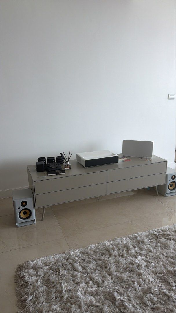 BoConcept Modern Grey TV Console Fermo with Drawers (Category: TV Consoles) located in Makati City. Submitted by ownersellerbgc (Listing ID 1469598490, Image 1). Description: Matt ash grey lacquered - Style: Clean contemporary lines with a neutral grey tone - Design: Supported by sturdy, slim metal legs - Condition: Solid build with minor wear from normal use - Versatility: Generous top surface space, perfect for electronics and decor.