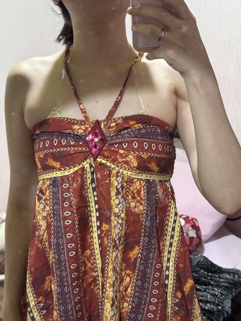 Bohemian Halter Mini Summer Beach Dress (Category: Dresses) located in Calamba. Submitted by j.catmama (Listing ID 1469690814, Image 3). Description: Used once. Fits XS-S. Height is 5’4”, weight 54kg. Bohemian Vibrant multi-color tribal and floral prints in red, yellow, and purple - Details: Halter neck tie with a sparkly rhinestone accent at the center bust - Fit: Strapless design with elastic smocking at the back for comfort and flexibility - P