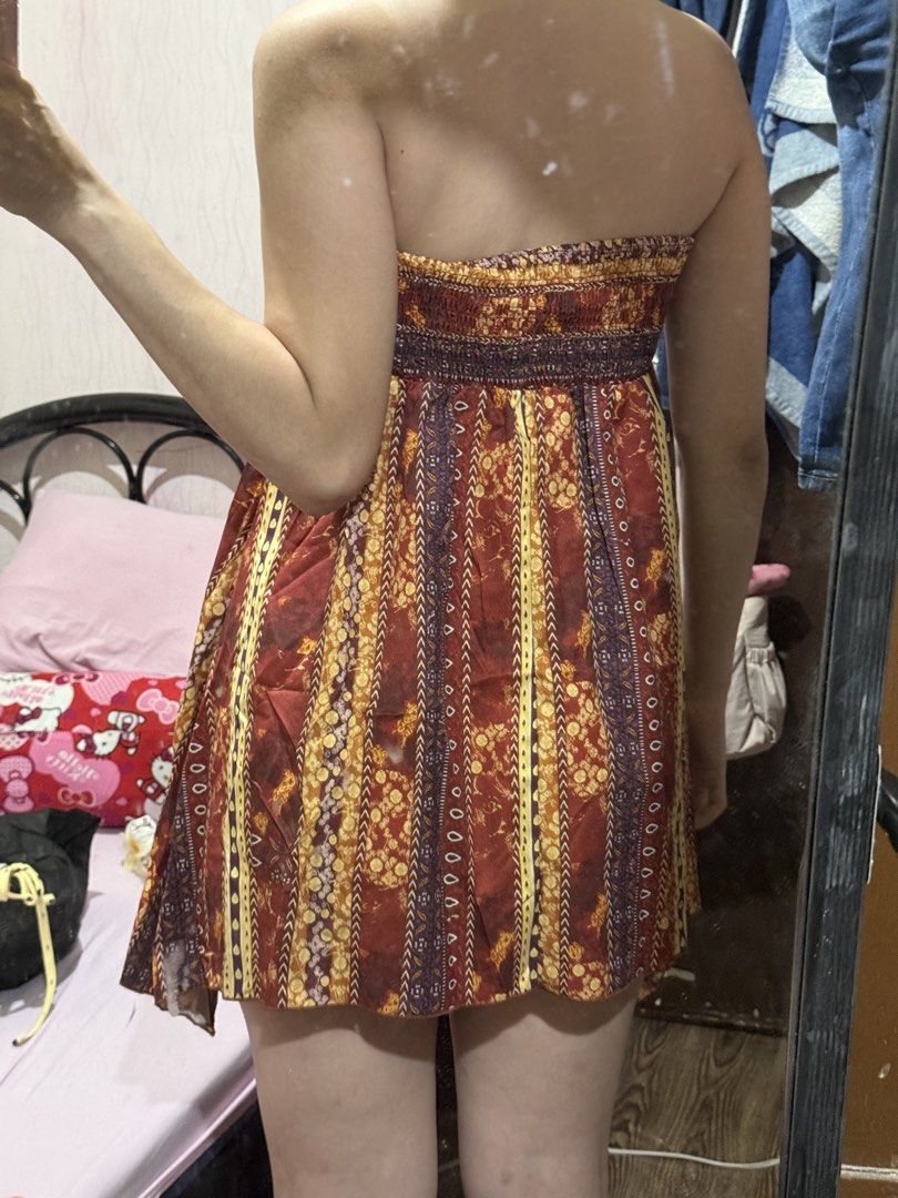 Bohemian Halter Mini Summer Beach Dress (Category: Dresses) located in Calamba. Submitted by j.catmama (Listing ID 1469690814, Image 2). Description: Used once. Fits XS-S. Height is 5’4”, weight 54kg. Bohemian Vibrant multi-color tribal and floral prints in red, yellow, and purple - Details: Halter neck tie with a sparkly rhinestone accent at the center bust - Fit: Strapless design with elastic smocking at the back for comfort and flexibility - P