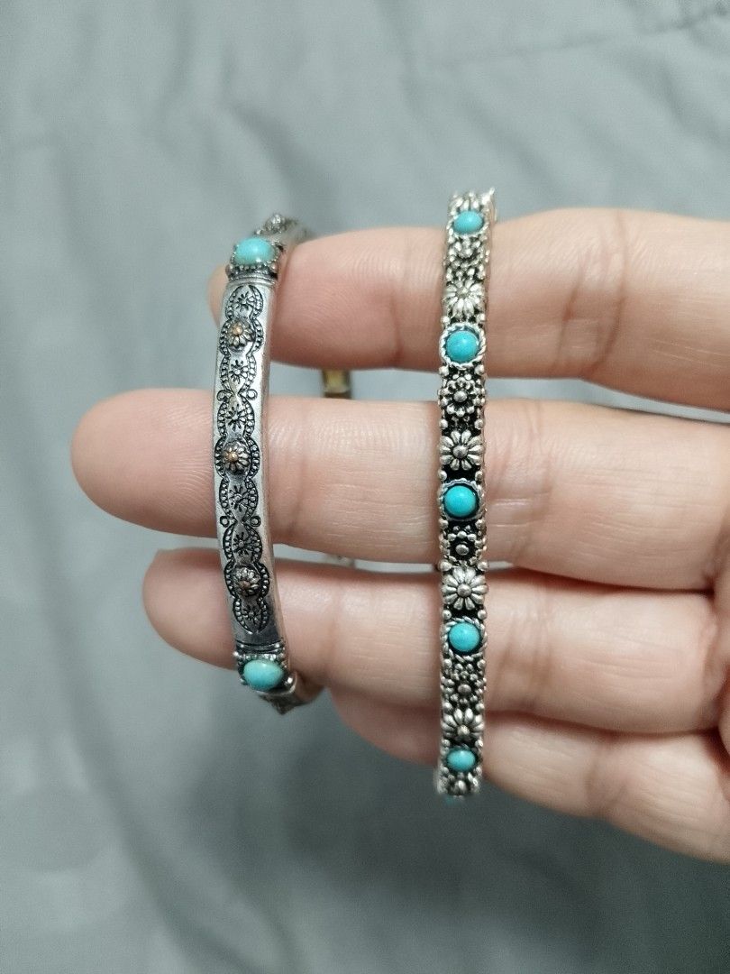 Boho Silver Tone Turquoise Beaded Bangles Set (Category: Bracelets) located in Manila. Submitted by batchi1019 (Listing ID 1469582279, Image 2). Description: - Set of 2 silver-tone bangles - Features bright turquoise beads - Detailed floral and textured engraved patterns - Convenient stretch-style design for easy wear - Versatile: wear stacked or separately - Perfect for adding a pop of color to any outfit.