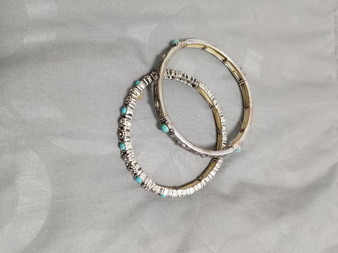 Boho Silver Tone Turquoise Beaded Bangles Set (Category: Bracelets) located in Manila. Submitted by batchi1019 (Listing ID 1469582279, Image 1). Description: - Set of 2 silver-tone bangles - Features bright turquoise beads - Detailed floral and textured engraved patterns - Convenient stretch-style design for easy wear - Versatile: wear stacked or separately - Perfect for adding a pop of color to any outfit.