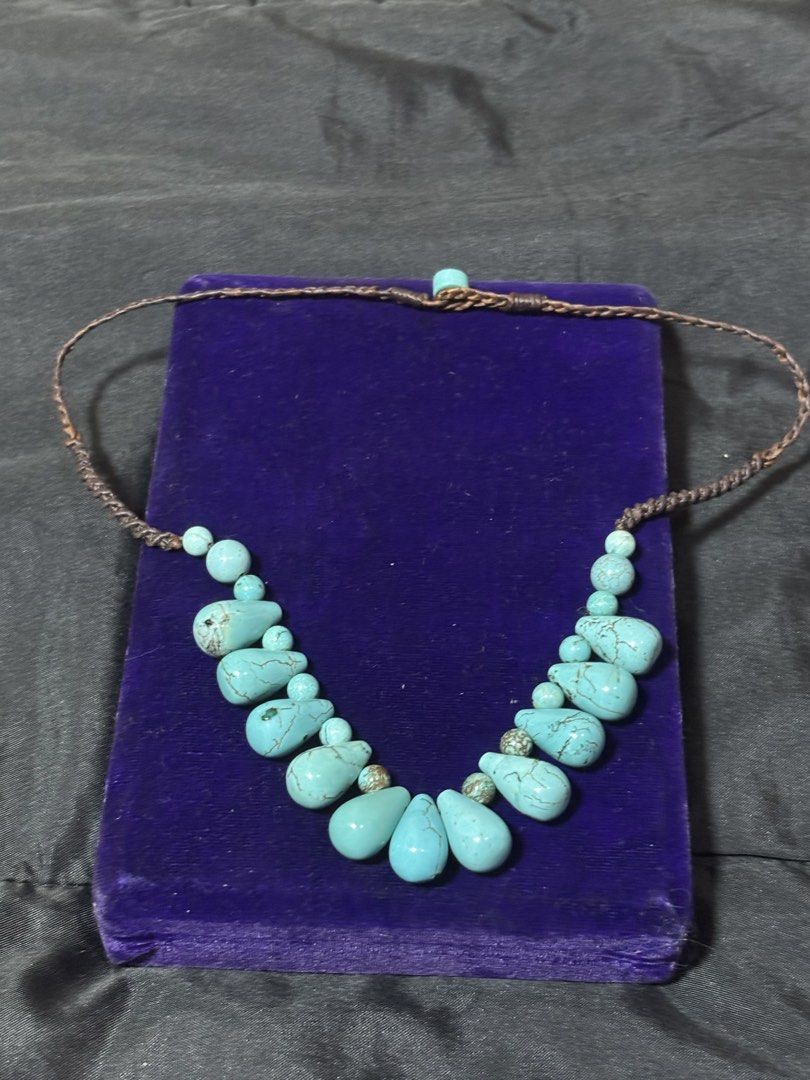 Boho Turquoise Stone Beaded Necklace with Braided Cord (Category: Necklaces) located in Caloocan City. Submitted by berndale_closet (Listing ID 1469608716, Image 1). Description: - Style: Earthy, bohemian statement necklace - Design: Graduated drop beads with natural stone matrix patterns - Material: Genuine turquoise gemstones and dark brown braided cord - Closure: Convenient loop closure at the back - Fit: Lightweight and comfortable around the