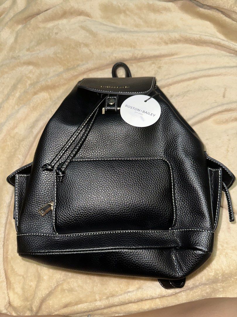 Boston + Bailey Black Pebbled Faux Leather Backpack (Category: Backpacks) located in Rizal. Submitted by jonaxxlizel (Listing ID 1469623419, Image 1). Description: - Brand: Boston + Bailey (Brand new with tags attached) - Color/Material: Black pebbled finish with white contrast stitching - Closure: Flap top with magnetic snap and drawstring main compartment - Pockets: Front zipped pocket, side pockets, and interior zippered wall pocket - Straps: 