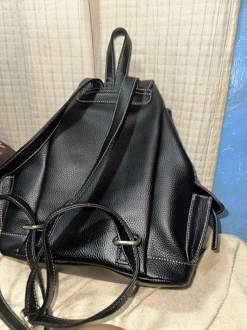 Boston + Bailey Black Pebbled Faux Leather Backpack (Category: Backpacks) located in Rizal. Submitted by jonaxxlizel (Listing ID 1469623419, Image 3). Description: - Brand: Boston + Bailey (Brand new with tags attached) - Color/Material: Black pebbled finish with white contrast stitching - Closure: Flap top with magnetic snap and drawstring main compartment - Pockets: Front zipped pocket, side pockets, and interior zippered wall pocket - Straps: 
