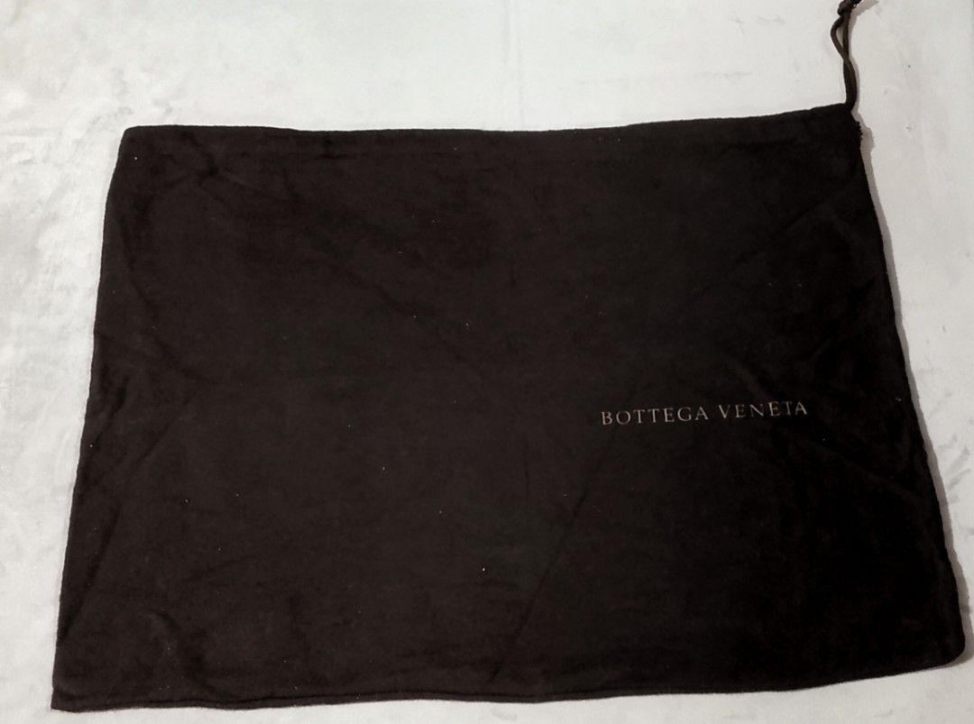 Bottega Veneta dustbag Med-large (Category: Luxury Accessories) located in Cabanatuan. Submitted by miss.maia (Listing ID 1469744107, Image 1). Description: This size is typically designed to fit medium-to-large luxury handbags. Based on Bottega Veneta's classic lineups that came with this specific dark brown/gold-lettering style packaging, this dust bag would perfectly suit: The Medium or Large "Veneta" Hobo Bag: One of the brand's most iconic w