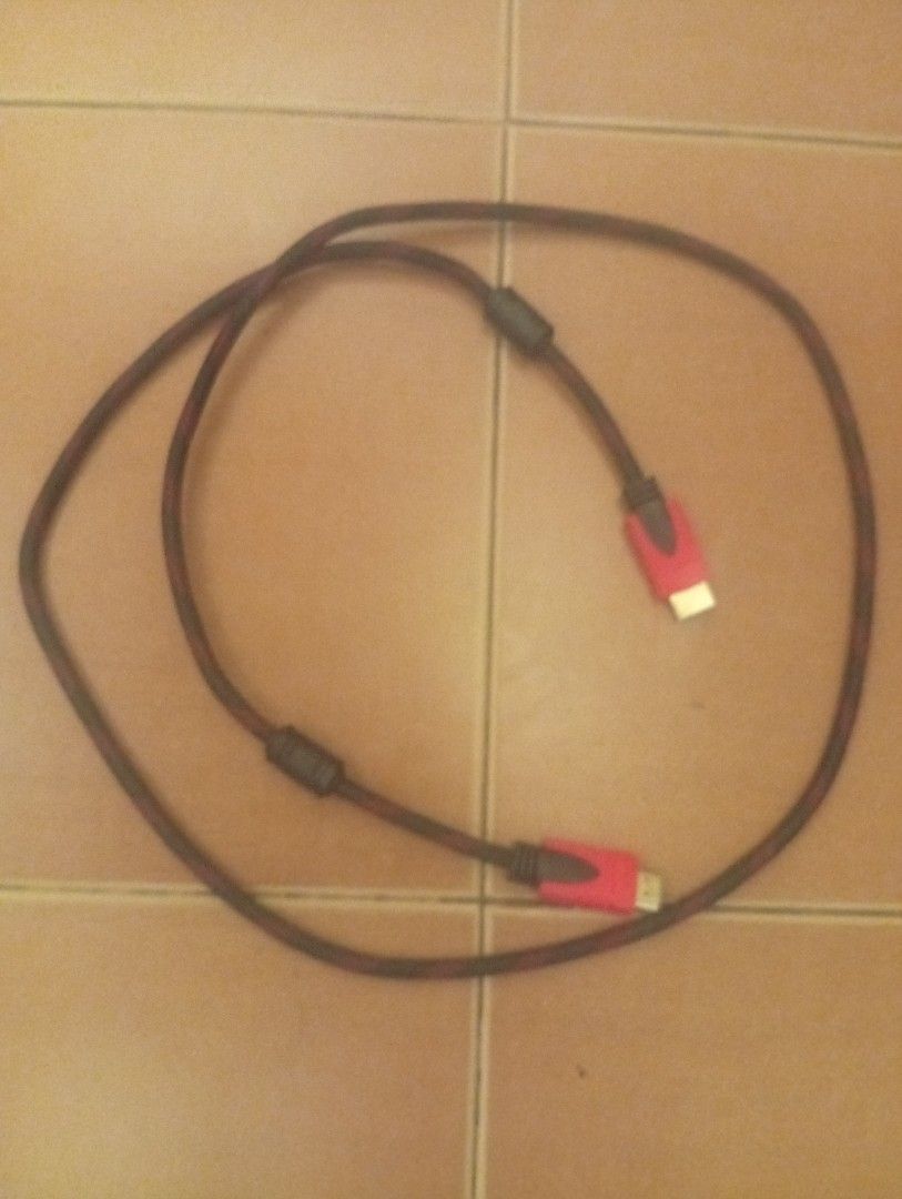 Braided HDMI Cable with Red Connectors (Category: Cables & Adaptors) located in Manila. Submitted by hipdrive (Listing ID 1469589068, Image 1). Description: - Premium braided HDMI cable in a stylish black and red weave - Gold-plated connectors with red hoods for durability and optimal signal - Built-in dual ferrite cores to minimize signal interference - Tangle-free design coils up easily for quick and neat setup - Perfect for connecting TVs, gam