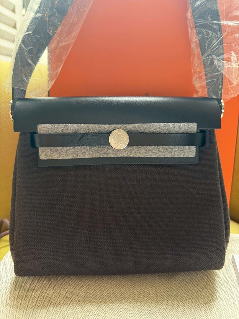 BRAND NEW MINI HERBAG (Category: Luxury Bags & Wallets) located in Taguig. Submitted by luxuryfindsforless (Listing ID 1469621834, Image 3). Description: Brand new Mini Herbag Complete set w/ store receipt Stamp G (2026) Color: au bai-brun & noir combo (hard to find) Purchased in Paris Oct 2026 P280,000 Pick-up: BGC.