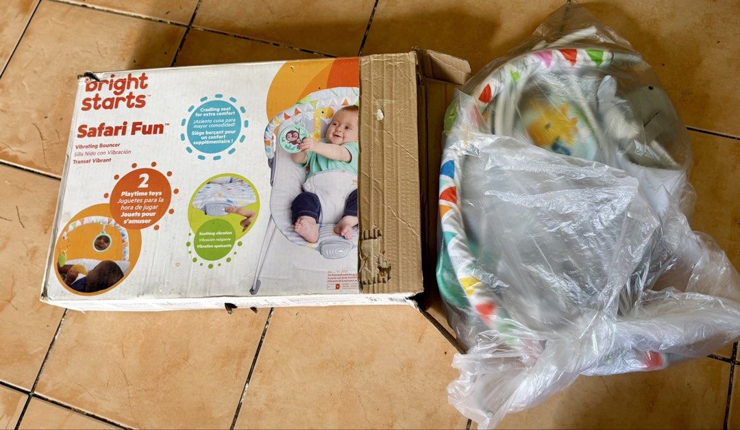 Bright Starts Safari Fun Vibrating Bouncer (Category: Infant Playtime) located in Taguig. Submitted by malditalovespurple (Listing ID 1469654903, Image 2). Description: - Brand: Bright Starts (Safari Fun Vibrating Bouncer) - Condition: Original box included - Features: Soothing vibration mode to calm baby - Comfort: Cradling seat design for extra support - Toys: Removable toy bar with 2 attached toys - Safety: Adjustable 3-point harness - Mainten
