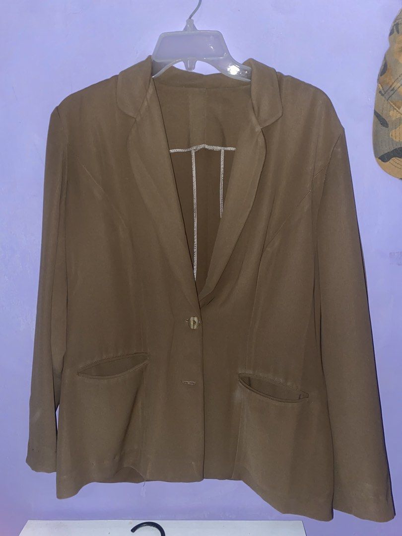 Brown tailored blazer with single button closure (Category: Coats, Jackets and Outerwear) located in Agdangan. Submitted by ishameicnd (Listing ID 1469690111, Image 2). Description: - Color: Brown - Design: Lapel collar with single front button fastening - Pockets: Two front welt pockets - Fit: Standard fit with long sleeves - Interior: Unlined with clean taped seam finish - Fabric: Lightweight, ideal for work or daily casual wear.