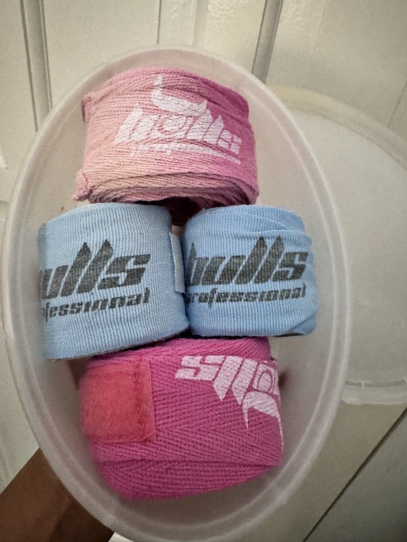 Bulls Professional Hand Wraps Bundle (Category: Combat Sports) located in Pasay City. Submitted by margucci_0823 (Listing ID 1469586608, Image 1). Description: - Brand: Bulls Professional - Quantity: Bundle of 4 wraps (2 light blue, 2 pink, including 1 gradient fade) - Material: Comfortable cotton with secure hook and loop velcro closures - Ideal for: Boxing, kickboxing, and Muay Thai training - Condition: Clean and ready for your next workout.