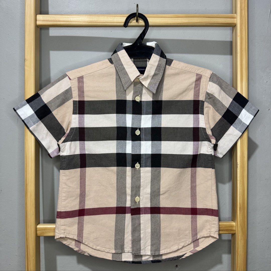 BURBERRY kids plaid polo (Category: Babies & Kids Fashion) located in Valenzuela. Submitted by thriftynanay88 (Listing ID 1469651120, Image 1). Description: Size 4Y on tag.