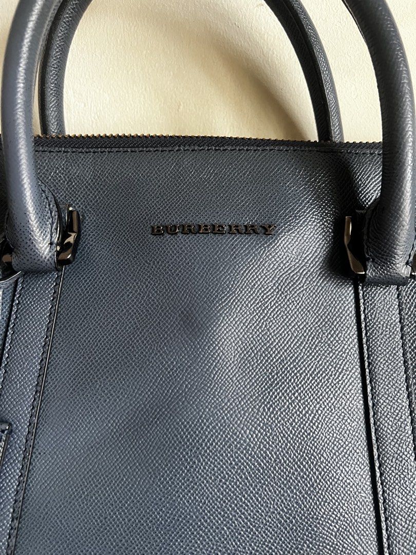 Burberry laptop bag (w/lock n key) (Category: Cross-body Bags) located in Valenzuela. Submitted by dianzskiyo (Listing ID 1469589945, Image 3). Description: LOCATION : VALENZUELA 🎀AVAILABLE! SOLD ITEMS ARE MARKED OR DELETED🎀 Preloved Burberry Laptop bag (NO SLING) 🗝️ Working lock and Key 🇷🇴Made in Romania 📍 what you see is what you get 📍 Managed ur expectation - this is preloved 📍 Slightly negotiable 📍 All details were already posted (pl