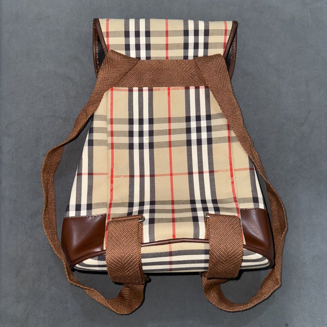 Burberry Vintage Nova Check / Haymarket Check Backpack (Category: Luxury Bags & Wallets) located in Calasiao. Submitted by jafaith_man (Listing ID 1469710062, Image 2). Description: Burberry Vintage Nova Check / Haymarket Check Backpack featuring a beige signature check canvas, brown leather trim, and a buckled flap closure..