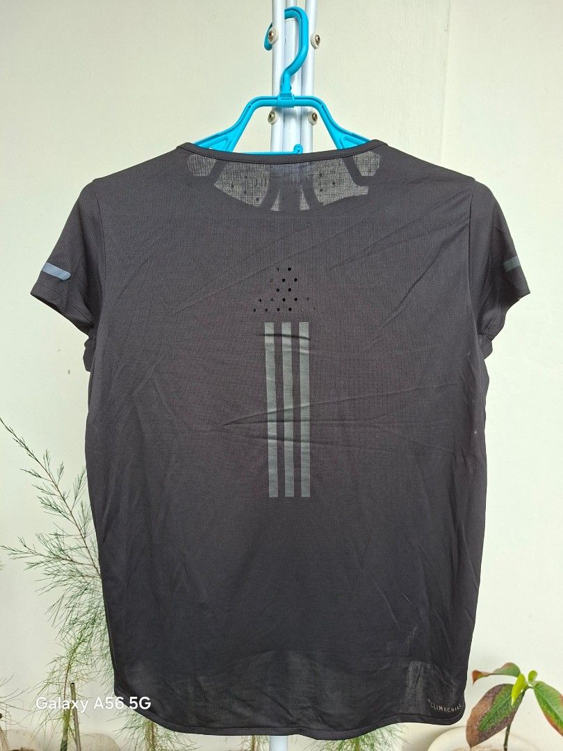 BUY 1 GET 1, ₱399 for both! (Category: Activewear) located in Tuguegarao City. Submitted by little_toto (Listing ID 1469594084, Image 2). Description: Please read carefully! Factory old stock, 2 tops: 🖤 Adidas ClimaChill top (black), size L Lightweight, breathable mesh fabric with a perforated back and reflective 3-stripe print. Cooling tech made for running and workouts. 🤍 White sports tee, mother and child with heart balloons print, tag size 