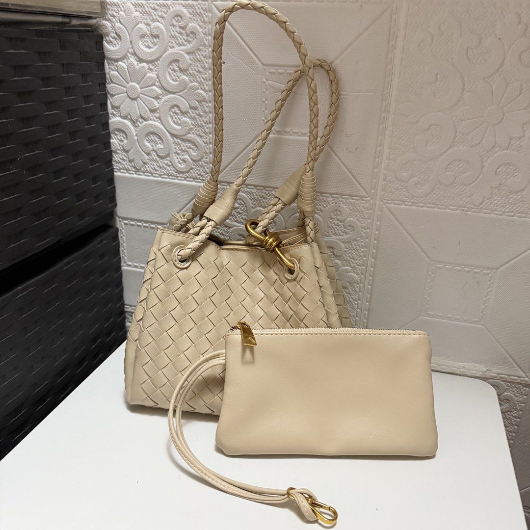 BV Parachute Inspired only (Category: Shoulder Bags) located in Davao. Submitted by tingz444less (Listing ID 1469753439, Image 1). Description: - Style: Classic intrecciato woven pattern in a versatile cream shade - Material: Premium leather with clean exterior and interior, no scuffs or marks - Hardware: Elegant gold-tone accents - Straps: Comfortable braided shoulder straps - Bonus: Includes a matching zippered pouch with a wrist strap - Condit